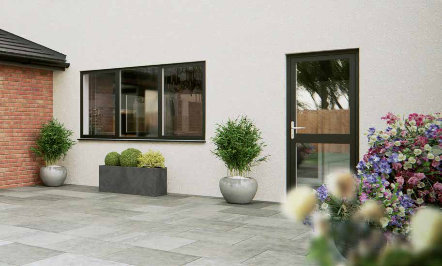 Aluminium flush residential door and window on a rendered house