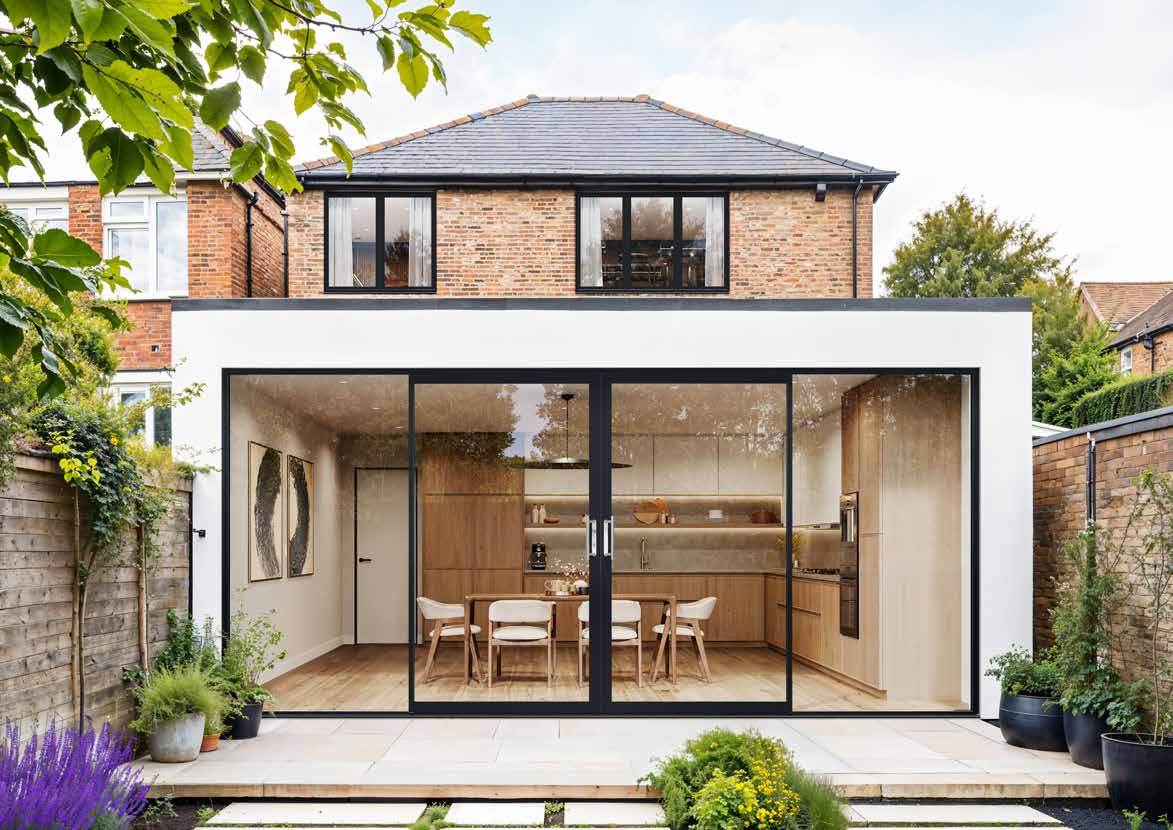 Rear extension with aluminium inline sliding doors onto a patio