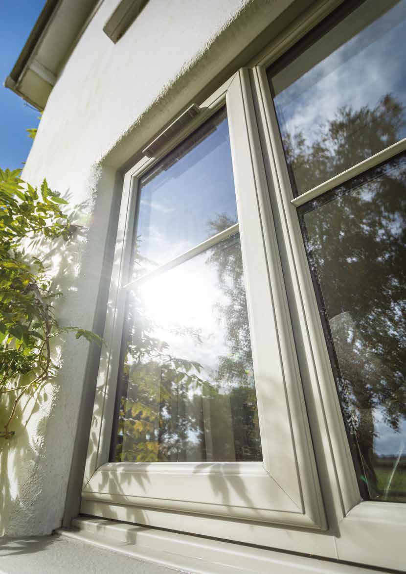 Cream sculptured uPVC casement window open in the sunshine