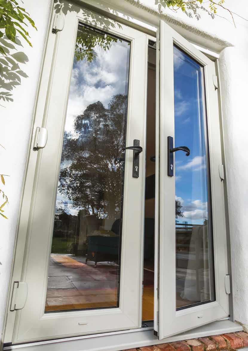 Cream uPVC French doors standing open onto a patio