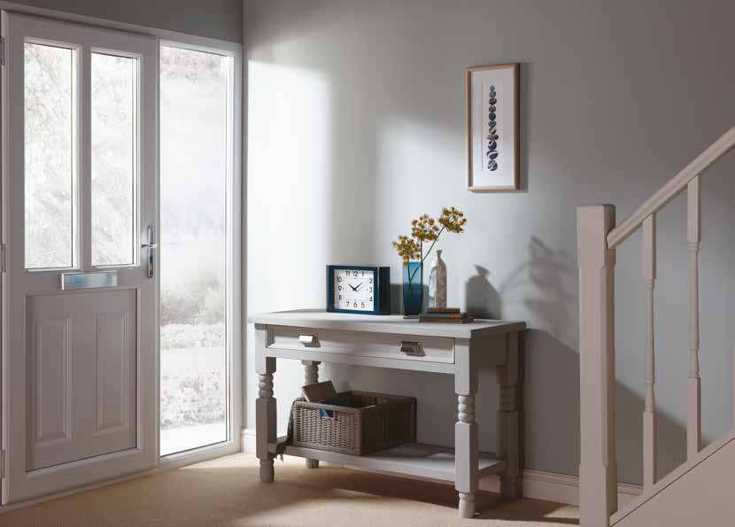uPVC residential door with a glazed side panel in a bright hallway