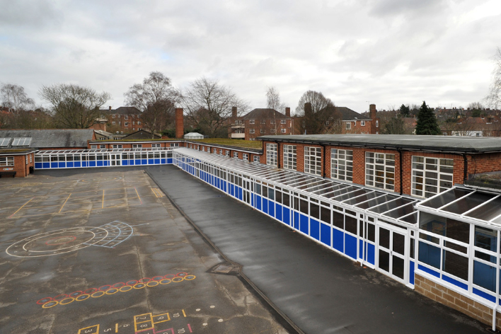 Glazed walkway canopy exterior - school commercial installation